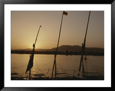 Moored Feluccas On The Nile River At Sunset by Kenneth Garrett Pricing Limited Edition Print image