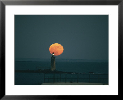 A Lighthouses Silhouette Against A Full Moon by Bill Curtsinger Pricing Limited Edition Print image
