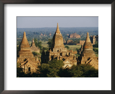 Buddhist Temples With Large Conical Tops Reach Heavenward by Paul Chesley Pricing Limited Edition Print image