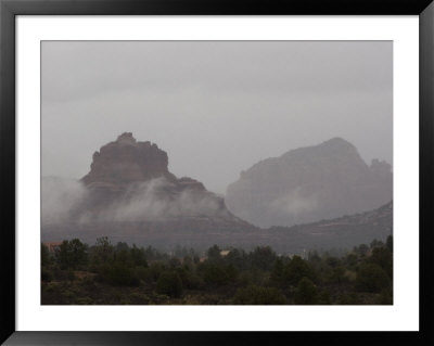Misty Rain Clouds Swirling Around Red Rocks In Sedona by Charles Kogod Pricing Limited Edition Print image