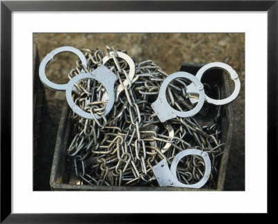 A Pile Of Chains And Handcuffs For Prisoners On A Chain Gang by Bill Curtsinger Pricing Limited Edition Print image