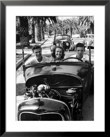Teenage Boys And Girl, Riding In Hopped Up Convertible Car Along Palm Tree Lined Street by Nina Leen Pricing Limited Edition Print image