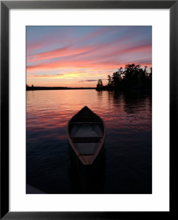 Canoe Floating In Lake During Sunset by Keith Levit Pricing Limited Edition Print image
