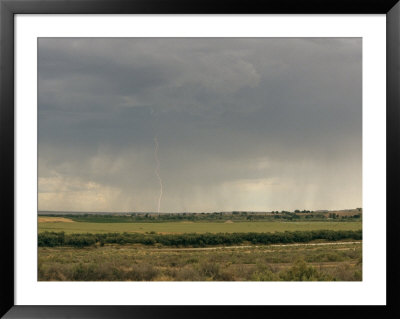Storm Clouds And A Lightning Bolt Near Grand Junction, Colorado by Richard Nowitz Pricing Limited Edition Print image