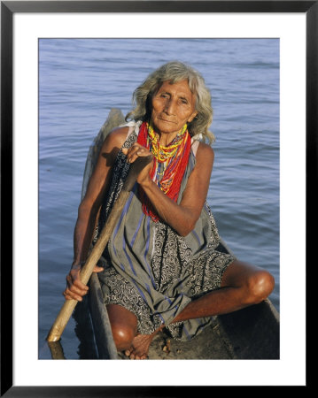 A Warao Indian In A Canoe by Ed George Pricing Limited Edition Print image