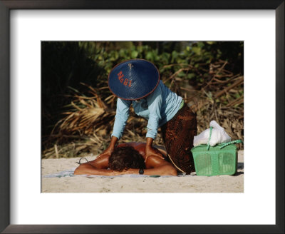 A Visitor Relaxes With A Massage At Kuta Beach, A Mekka For Tourists by Michael S. Yamashita Pricing Limited Edition Print image