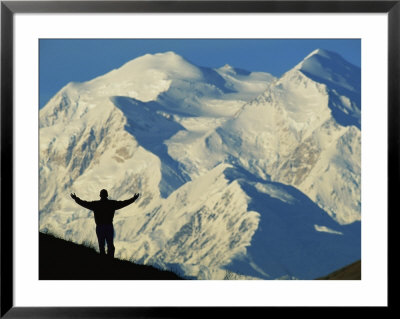 A Hiker Silhouetted Against Snow-Covered Mount Mckinley by Joel Sartore Pricing Limited Edition Print image