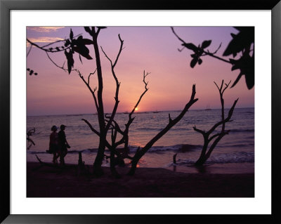 Couple And Sunset,Tamarindo, Costa Rica by Jennifer Broadus Pricing Limited Edition Print image