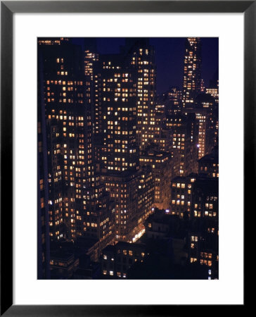 Skyscrapers Lit Up As Evening Descends by Andreas Feininger Pricing Limited Edition Print image