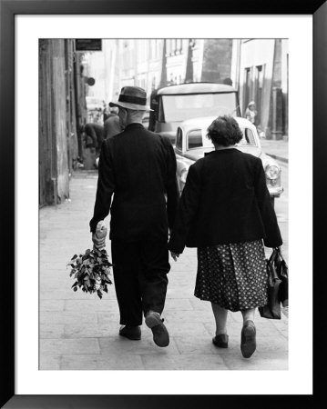 Elderly Polish Couple Walking Hand In Hand by Paul Schutzer Pricing Limited Edition Print image