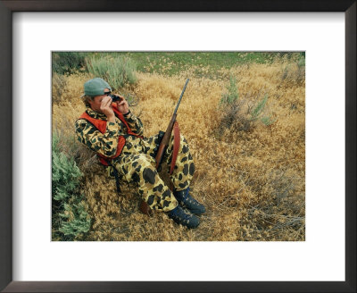 A Hunter Uses Binoculars To Spot Game by Gordon Wiltsie Pricing Limited Edition Print image