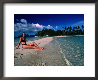Woman Sunbathing On Sand Spit Of Snick Island, El Nido, Philippines by Mark Daffey Pricing Limited Edition Print image
