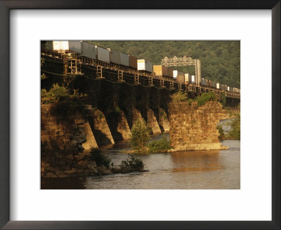 A Freight Train Crosses The Rockville Bridge by Raymond Gehman Pricing Limited Edition Print image