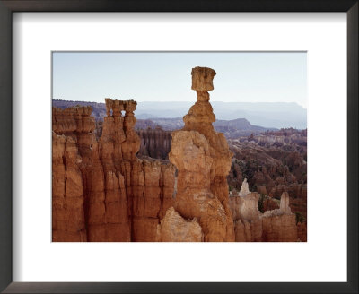 Spire-Like Rock Formations Stand In The Desert by George F. Mobley Pricing Limited Edition Print image