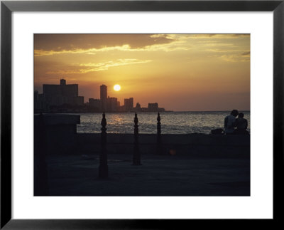 A Couple Embraces On Havanas Malecon by David Evans Pricing Limited Edition Print image