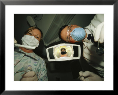 A Dentist And Dental Hygienist Prepare For An Examination by Joel Sartore Pricing Limited Edition Print image