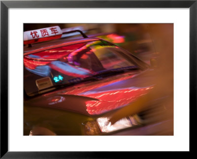 Taxi Cab Along Neon-Lit Nanjing Road, Shanghai, China by Paul Souders Pricing Limited Edition Print image