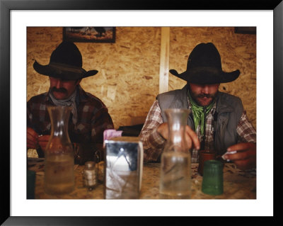 A Pair Of Cowboys Enjoy A Cup Of Coffee At A Local Restaurant by Joel Sartore Pricing Limited Edition Print image
