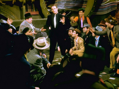Actor Stubby Kaye, Marlon Brando And Others In Sewer Crap Game Scene From Guys And Dolls by Gjon Mili Pricing Limited Edition Print image