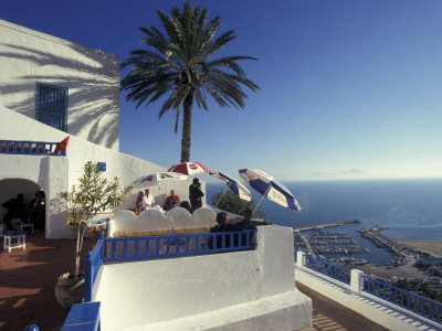 Restaurant Terrace On The Mediterranean Sea, Tunisia by Michele Molinari Pricing Limited Edition Print image