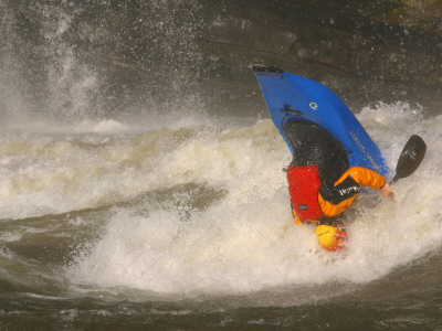A Whitewater Kayaker Upside Down Halfway Through A Loop Move by Skip Brown Pricing Limited Edition Print image