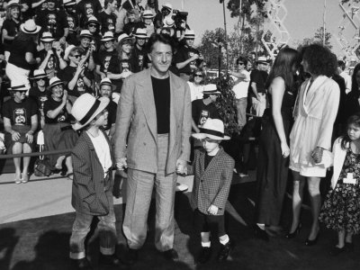 Actor Dustin Hoffman Holding And Family At Dick Tracy Premiere, Orlando, Fl by Albert Ferreira Pricing Limited Edition Print image