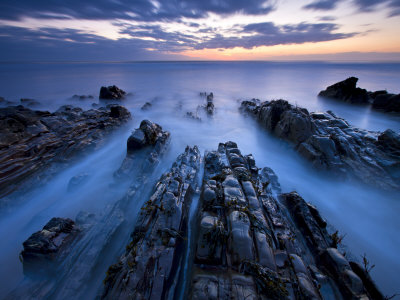 Advancing Tide On The Rocky Ledges Of Sandymouth, Cornwall, England by Adam Burton Pricing Limited Edition Print image