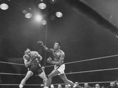 Boxing Match Between Carmen Basilo And Sugar Ray Robinson by Frank Scherschel Pricing Limited Edition Print image
