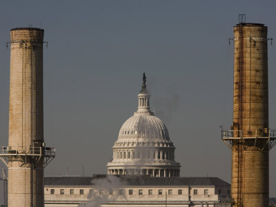 Capitol Dome Looms Behind Smokestacks Of A Coal-Fired Power Plant by Tyrone Turner Pricing Limited Edition Print image