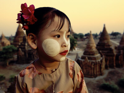 Burmese Girl Wearing Thanaka Face Paint Atop Temple In Pagan, Burma by Scott Stulberg Pricing Limited Edition Print image