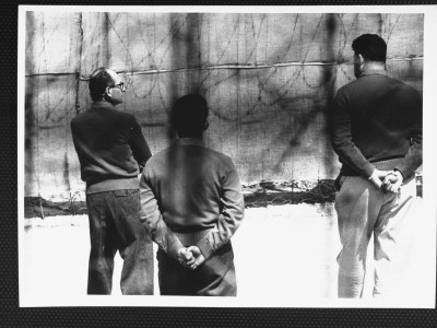 Nazi War Criminal Adolf Eichmann In Exercise Yard, Attempting To Talk With Guards At Djalameh Jail by Gjon Mili Pricing Limited Edition Print image