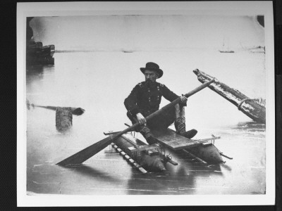 Union Officer Holding Oar And Sitting On Makeshift Raft Used For Scouting Operations, Civil War by Andrew Joseph Russell Pricing Limited Edition Print image