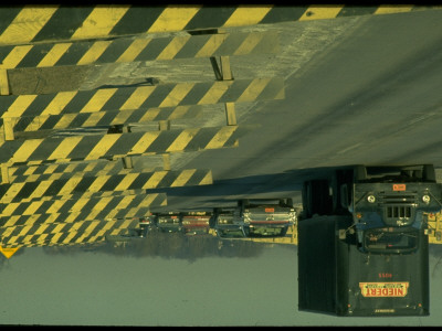 Line Of Barricades Blocking Lane With Heavy Traffic In Remaining 2 Lanes On Decaying Overpass by Ralph Crane Pricing Limited Edition Print image
