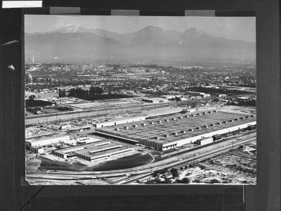 New Expansive Convair Guided Missile Plant, Smog-Veiled Mountains Loom In The Background by J. R. Eyerman Pricing Limited Edition Print image
