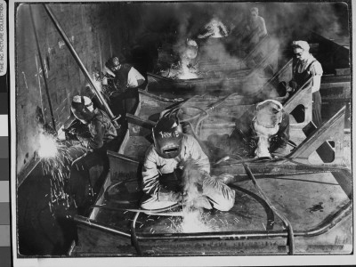 Helmeted Women Busy Welding Seams On A Deck Section Of An Aircraft Carrier At Shipyard by Margaret Bourke-White Pricing Limited Edition Print image