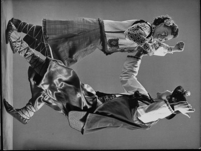 Two Dancers Demonstrating The Squatting Step Of The Kolomeyka, A Ukrainian Dance by Gjon Mili Pricing Limited Edition Print image
