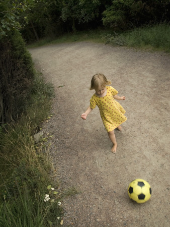A Little Girl Playing With A Football by Julia Sjoberg Pricing Limited Edition Print image