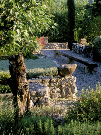 La Chabaude, France, Designer: Scott Stover: Stone Wall, Gravel Terrace, Long Wooden Bench by Clive Nichols Pricing Limited Edition Print image