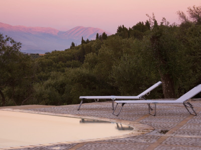 Sun Loungers On Pool Terrace At Sunset by Clive Nichols Pricing Limited Edition Print image