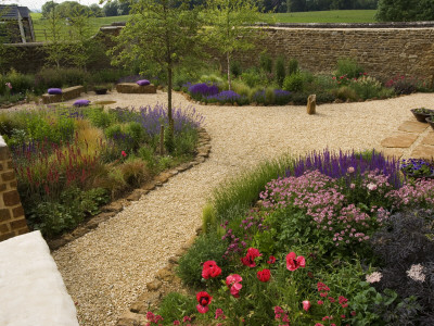 Gravel Garden With Rocks And Borders Of Grasses And Perennials by Clive Nichols Pricing Limited Edition Print image