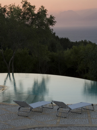 Loungers On Terrace Beside Infinity Pool At Sunset, Corfu by Clive Nichols Pricing Limited Edition Print image