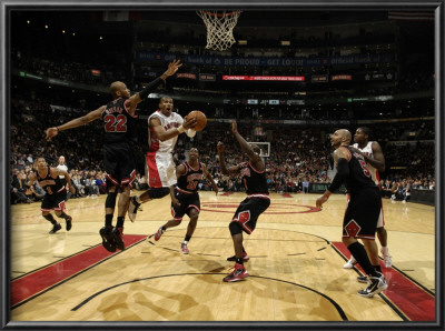 Chicago Bulls V Toronto Raptors: Taj Gibson And Leandro Barbosa by Ron Turenne Pricing Limited Edition Print image