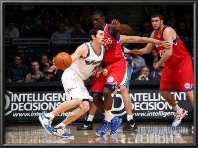 Philadelphia 76Ers V Washington Wizards: Kirk Hinrich And Jrue Holiday by Ned Dishman Pricing Limited Edition Print image