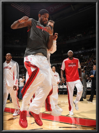 Philadelphia 76Ers V Toronto Raptors: Amir Johnson And Jose Calderon by Ron Turenne Pricing Limited Edition Print image