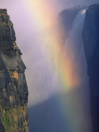 Victoria Falls With Rainbow In Spray, Zimbabwe by Pete Oxford Pricing Limited Edition Print image