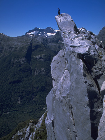 Climber On The Summit Of A Rock Tower, Chile by Pablo Sandor Pricing Limited Edition Print image