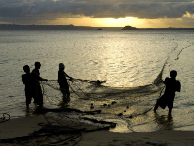 Fishermen Pulling In The Nets At Dawn, Ramena Beach, Diego Suarez, North Madagascar by Inaki Relanzon Pricing Limited Edition Print image