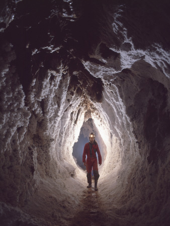 Potholer Wallking Along Narrow Underground Passage, Cova Lachambre, Ria, Conflent, Pyrenees, France by Inaki Relanzon Pricing Limited Edition Print image