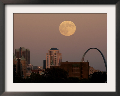 A Full Moon Rises Behind Downtown Saint Louis Buildings And The Gateway Arch Friday by Charlie Riedel Pricing Limited Edition Print image