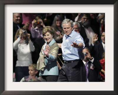 President Bush, Right, And First Lady Laura Bush Arrive For A Rally For Texas Governor Rick Perry by Lm Otero Pricing Limited Edition Print image
